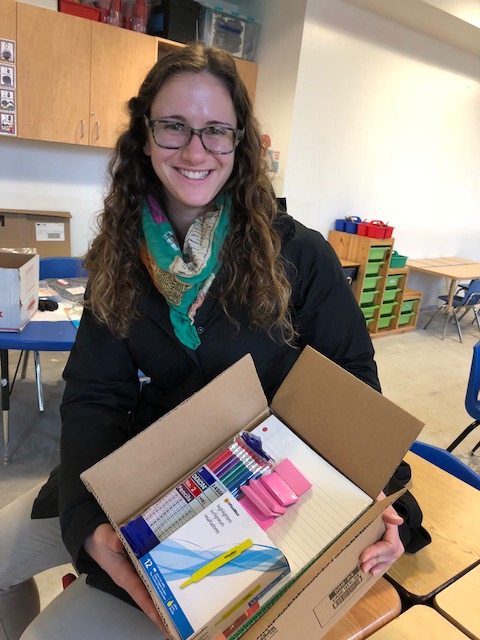 The Intergenerational School Teacher with box of supplies