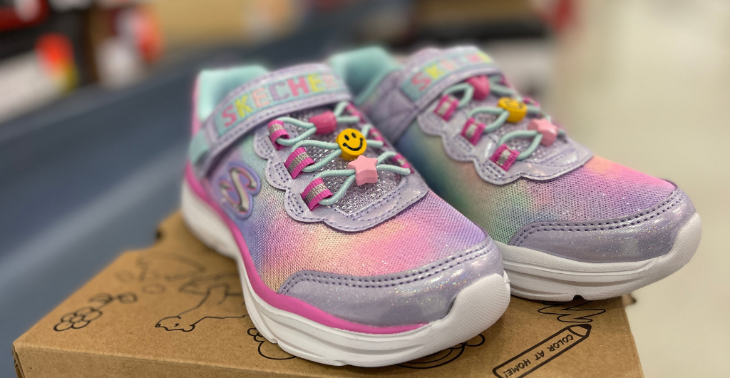 New pair of pastel rainbow girls shoes sitting on a shoebox